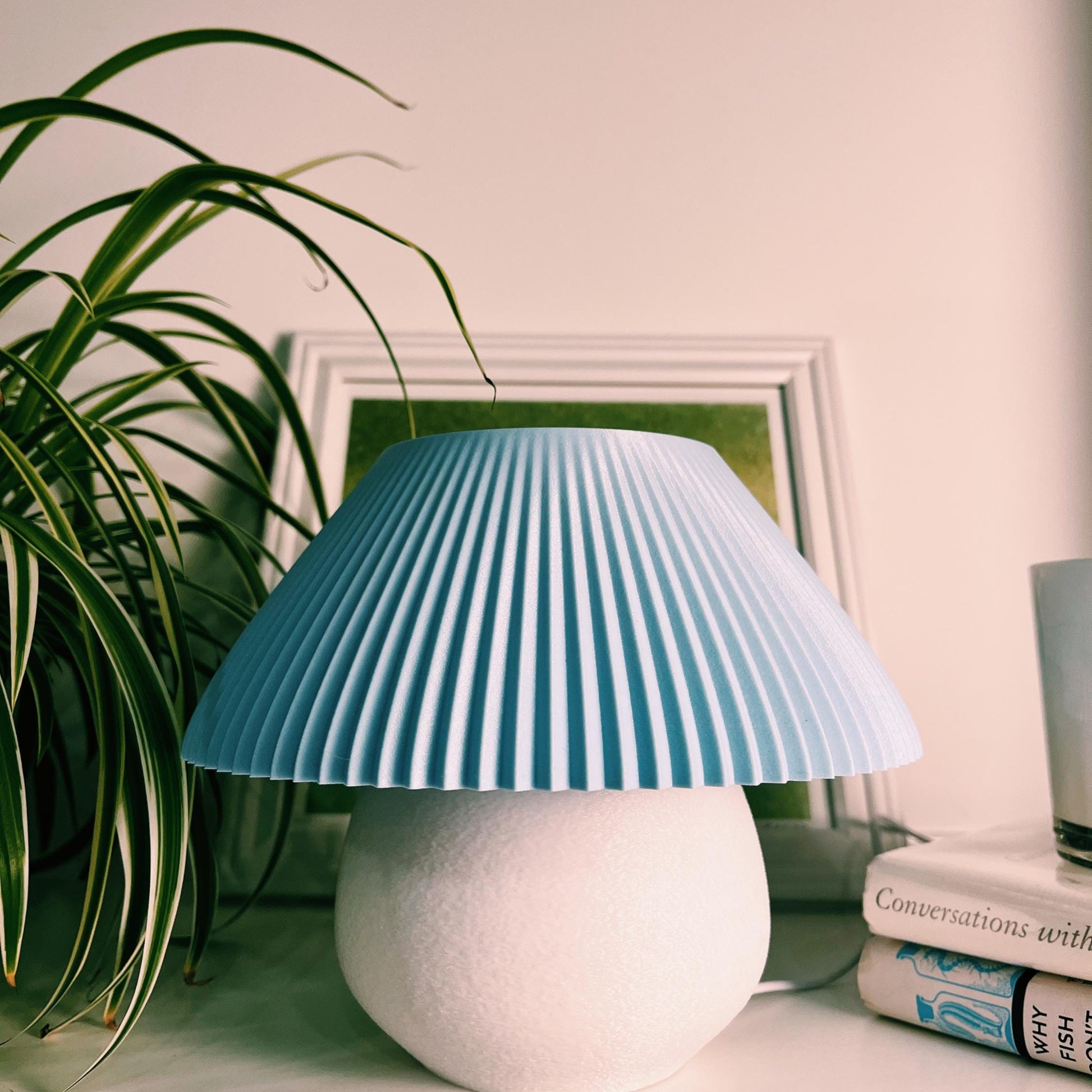 Blue Petal Lamp with sculptural pleated shade and cool, calming light