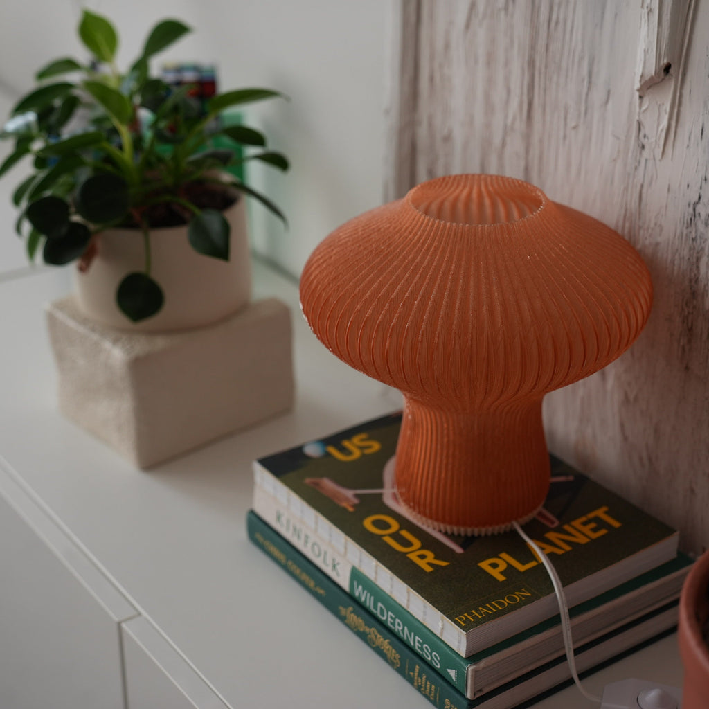 NAMU lamp switched off, showing the amber ribbed shade in daylight